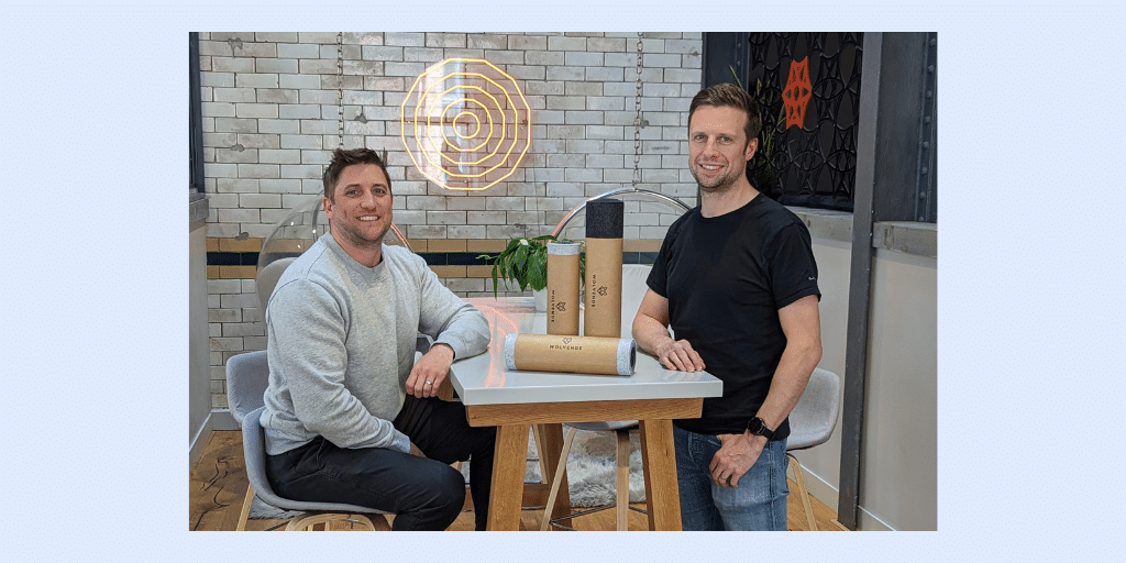 Carl and Adam standing with their desk mats Wolvende